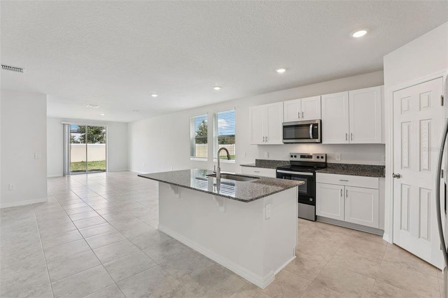 Furnished interior view inside a new home in Lawson Dunes - Signature Series, Haines City (Image 4).