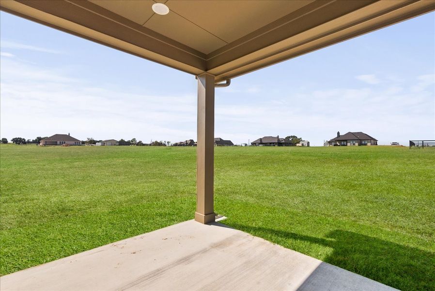Exterior details and patio area of a home in Honeysuckle Ranch, Springtown (Image 2).