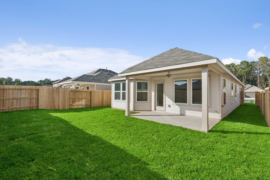 Exterior details and patio area of a home in Pinewood at Grand Texas, New Caney (Image 3).