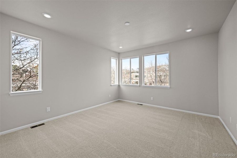 Spacious, unfurnished interior of a new home in Ralston Creek, Arvada (Image 32).