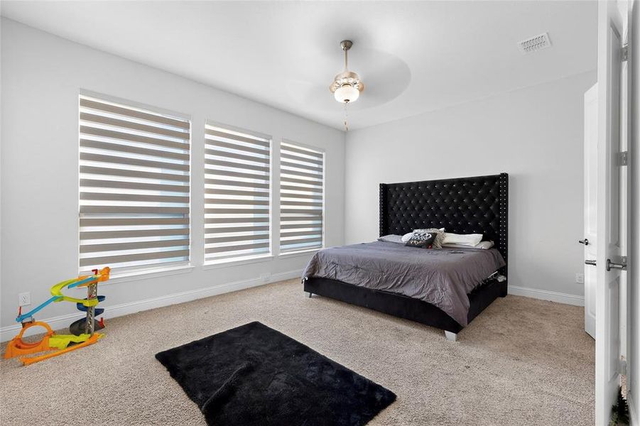 Bedroom featuring carpet floors and a ceiling fan