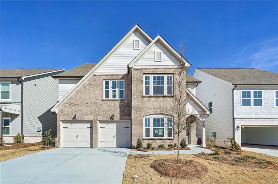 Front exterior of a new home in Eastlyn Crossing - Single Family, Flowery Branch, GA, highlighting curb appeal (Image 22). Front exterior of a new home in Eastlyn Crossing - Single Family, Flowery Branch, GA, highlighting curb appeal (Image 22).