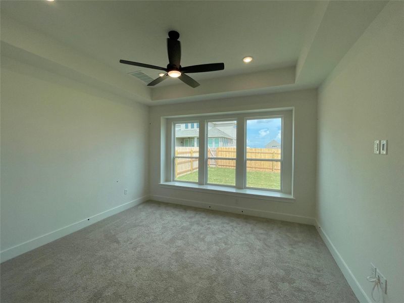 Primary Bedroom with tray ceiling Primary Bedroom with tray ceiling
