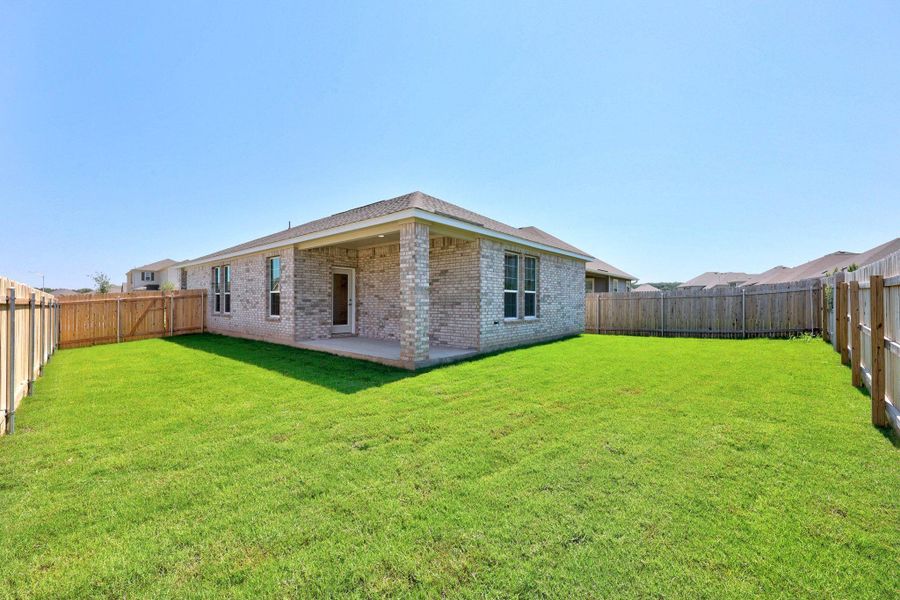Front exterior of a new home in Retreat at San Gabriel, Georgetown, TX, highlighting curb appeal (Image 18). Front exterior of a new home in Retreat at San Gabriel, Georgetown, TX, highlighting curb appeal (Image 18).