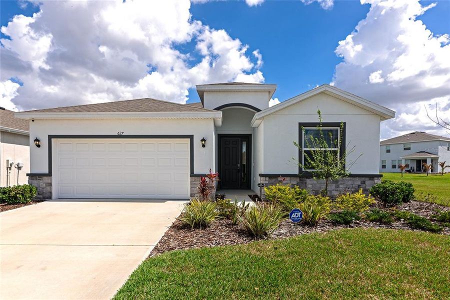 Front exterior of a new home in Coddington, Bradenton, FL, highlighting curb appeal (Image 21).