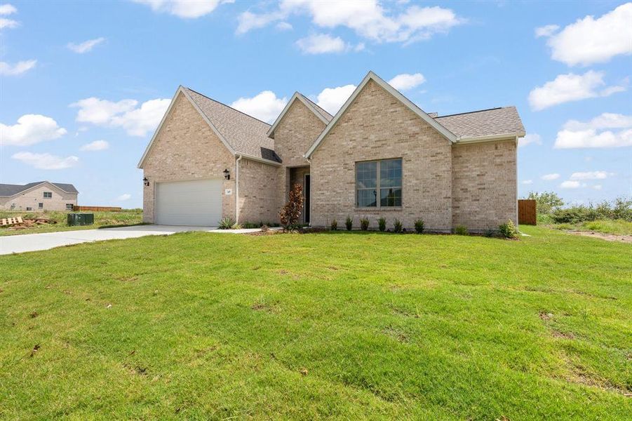 Front exterior of a new home in , Venus, TX, highlighting curb appeal (Image 33). Front exterior of a new home in , Venus, TX, highlighting curb appeal (Image 33).