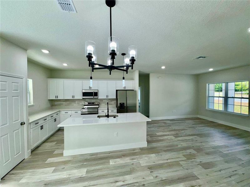 Furnished interior view inside a new home in , Dunnellon (Image 8).