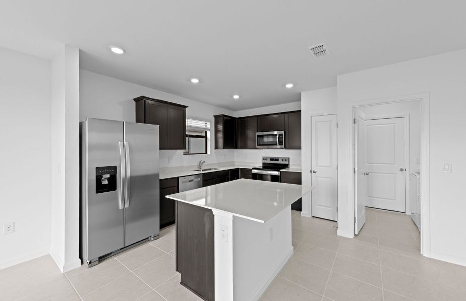 Furnished interior view inside a new home in Caloosa Cove, Labelle (Image 11).
