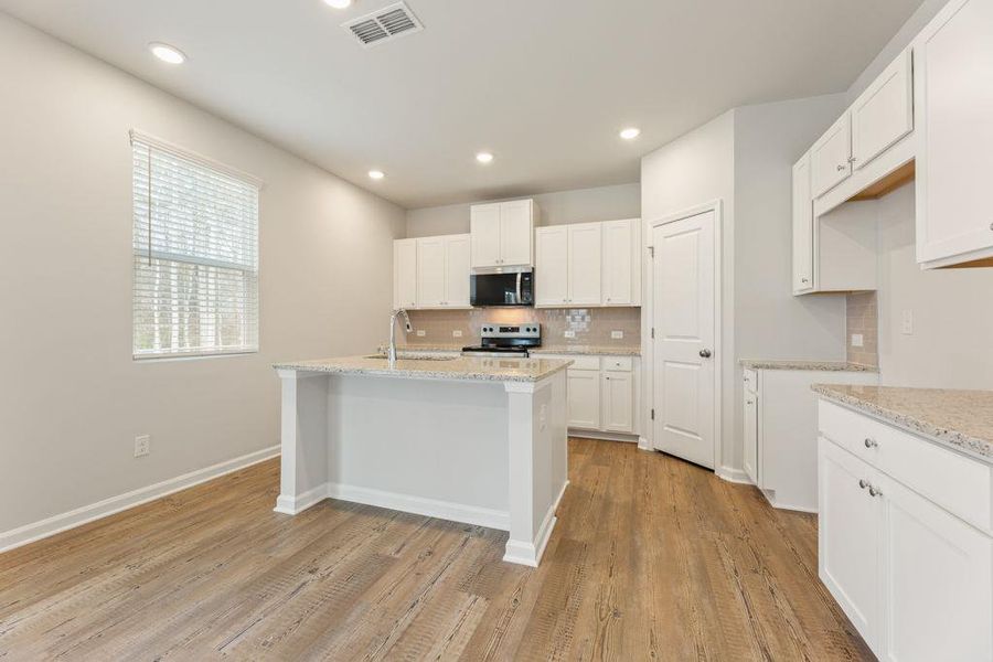 Furnished interior view inside a new home in Belleview Manor, Fairburn (Image 6).