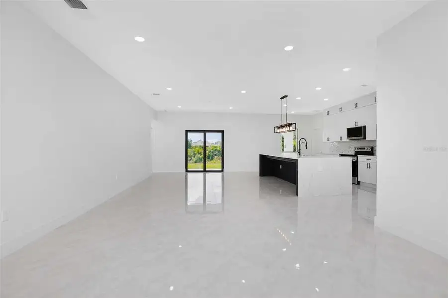 Spacious, unfurnished interior of a new home in , Port Charlotte (Image 55).