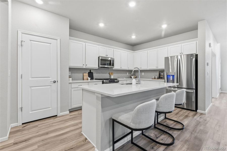 Furnished interior view inside a new home in Woodrose at Painted Prairie, Aurora (Image 16).