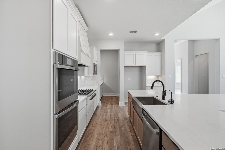 Furnished interior view inside a new home in Potranco Oaks, Castroville (Image 7).