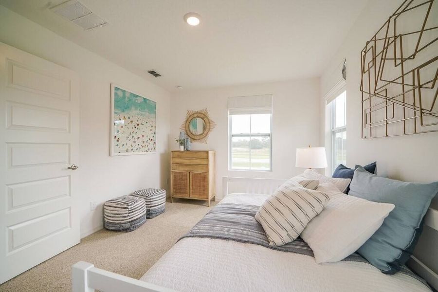 Furnished interior in a model home at The Enclaves at Festival Cove in Davenport (Image 14).