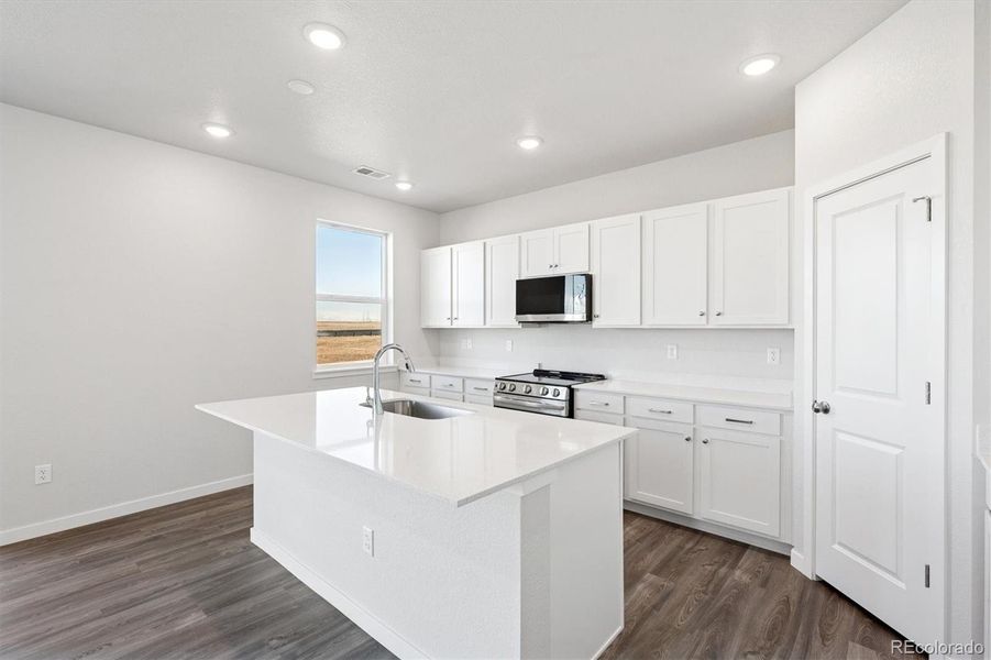 Furnished interior view inside a new home in The Aurora Highlands, Aurora (Image 6).
