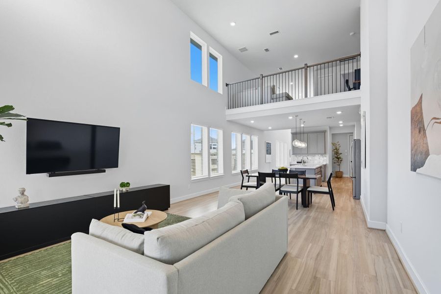 A look back toward the family room from the back door from which you will notice the open balcony to the upstairs game room!
