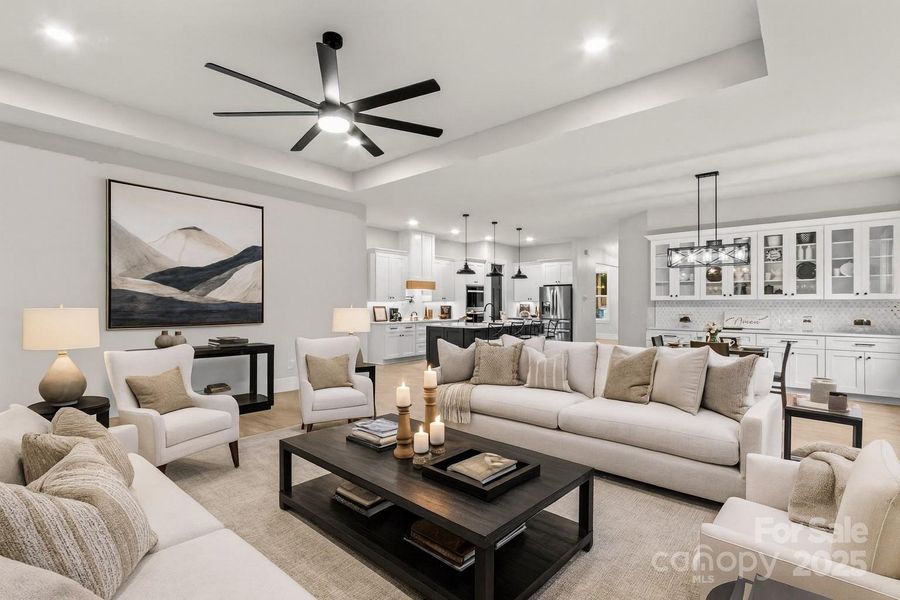Elegant open plan with large Kitchen, Den & Dining together. Notice the 11 ft tray ceiling.