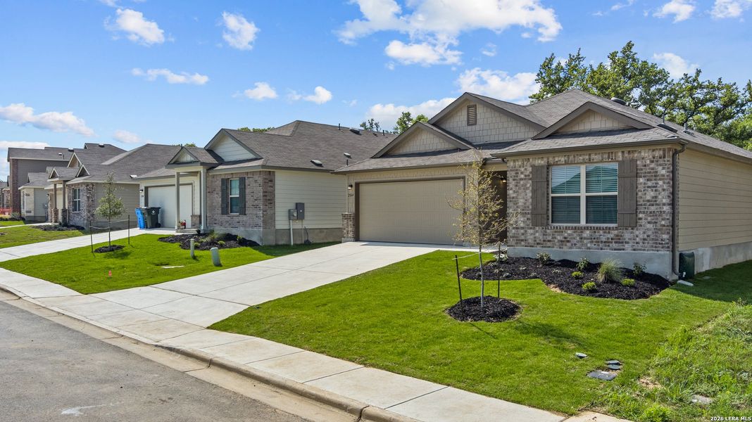 Front exterior of a new home in Greenspoint Heights, Seguin, TX, highlighting curb appeal (Image 1). Front exterior of a new home in Greenspoint Heights, Seguin, TX, highlighting curb appeal (Image 1).