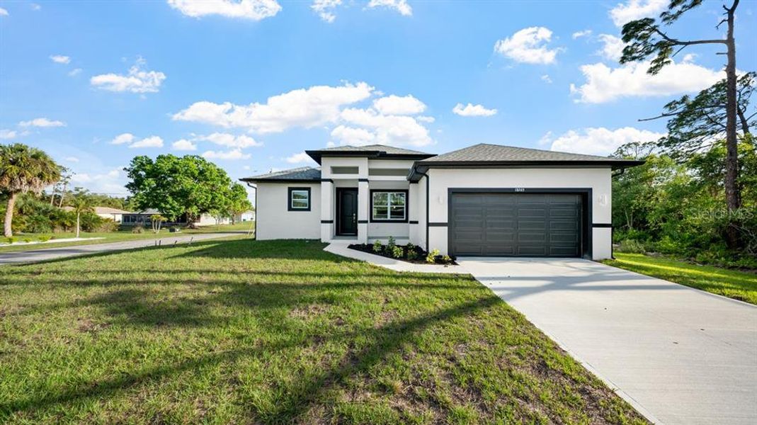 Front exterior of a new home in , Port Charlotte, FL, highlighting curb appeal (Image 23). Front exterior of a new home in , Port Charlotte, FL, highlighting curb appeal (Image 23).