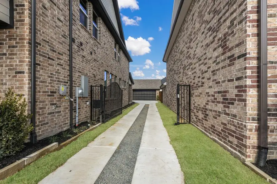 With striking brick and dark trim, a private, gated drive and rear garage, this charming dream home has outstanding curb appeal! With striking brick and dark trim, a private, gated drive and rear garage, this charming dream home has outstanding curb appeal!