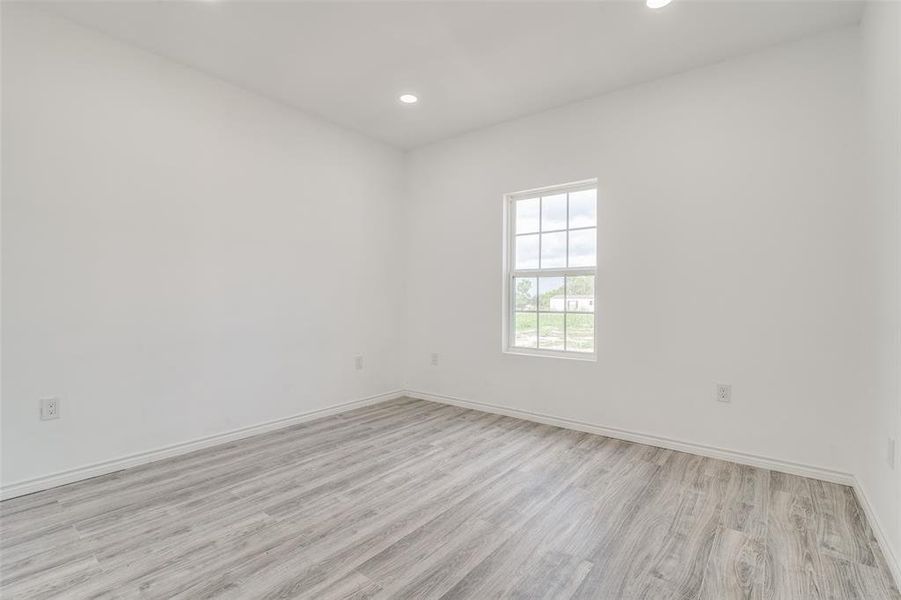 Spare room featuring light hardwood / wood-style floors