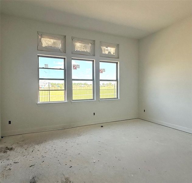 Unfurnished room with baseboards Unfurnished room with baseboards