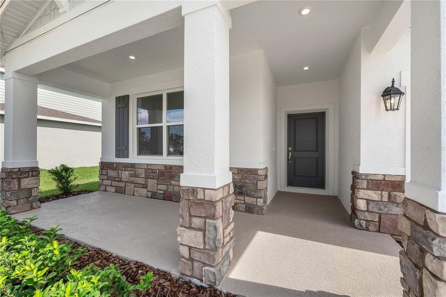 Exterior details and patio area of a home in Green Leaf, West Melbourne (Image 20).