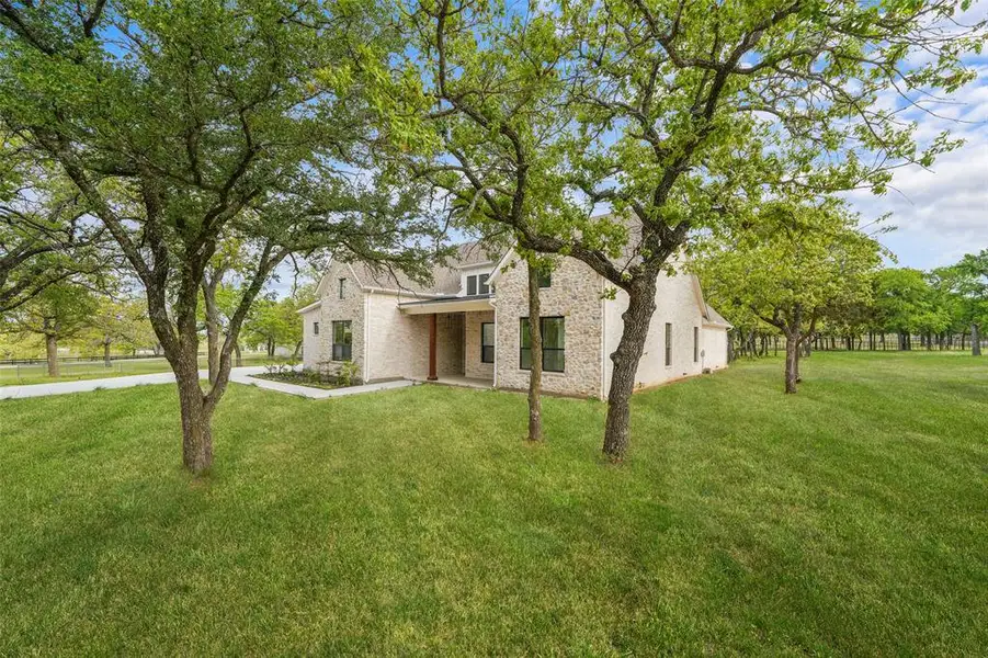 Exterior details and patio area of a home in , Weatherford (Image 26).