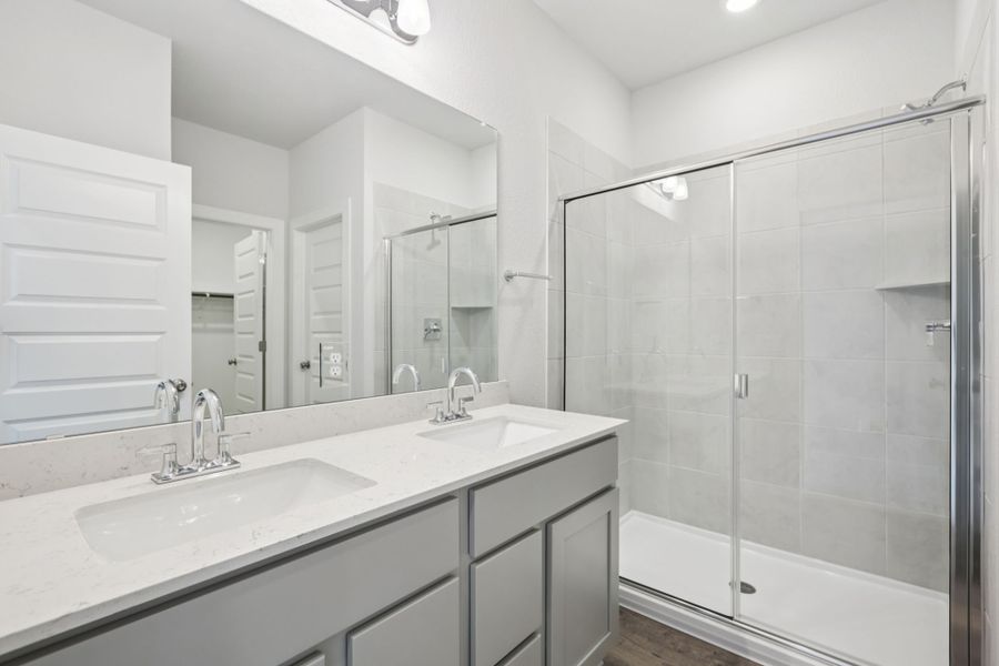 A bathroom with a glass shower.