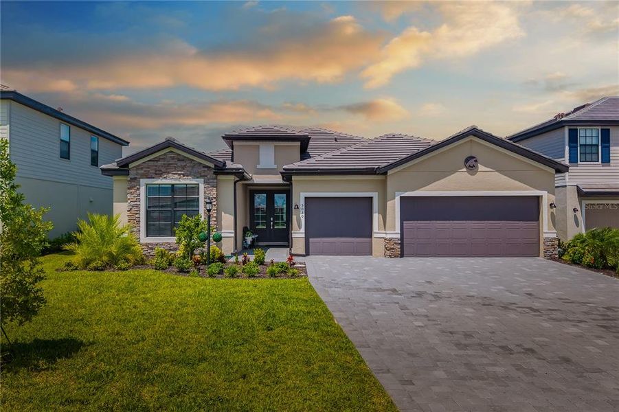 Front exterior of a new home in , Bradenton, FL, highlighting curb appeal (Image 20).