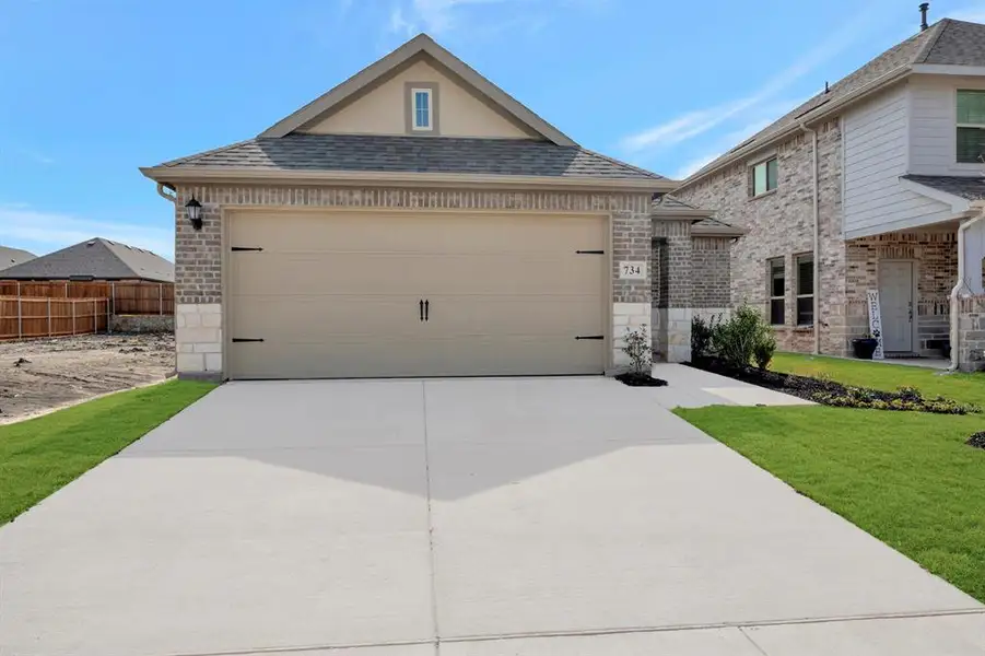Front exterior of a new home in Elevon, Lavon, TX, highlighting curb appeal (Image 1). Front exterior of a new home in Elevon, Lavon, TX, highlighting curb appeal (Image 1).