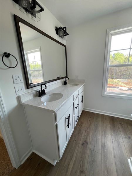 This bathroom features a contemporary double vanit