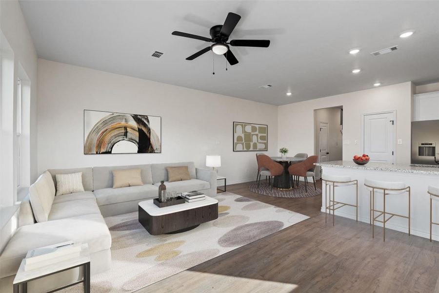 This virtually staged view captures the common area from a different perspective, emphasizing spaciousness, clean lines, and flexible living options.