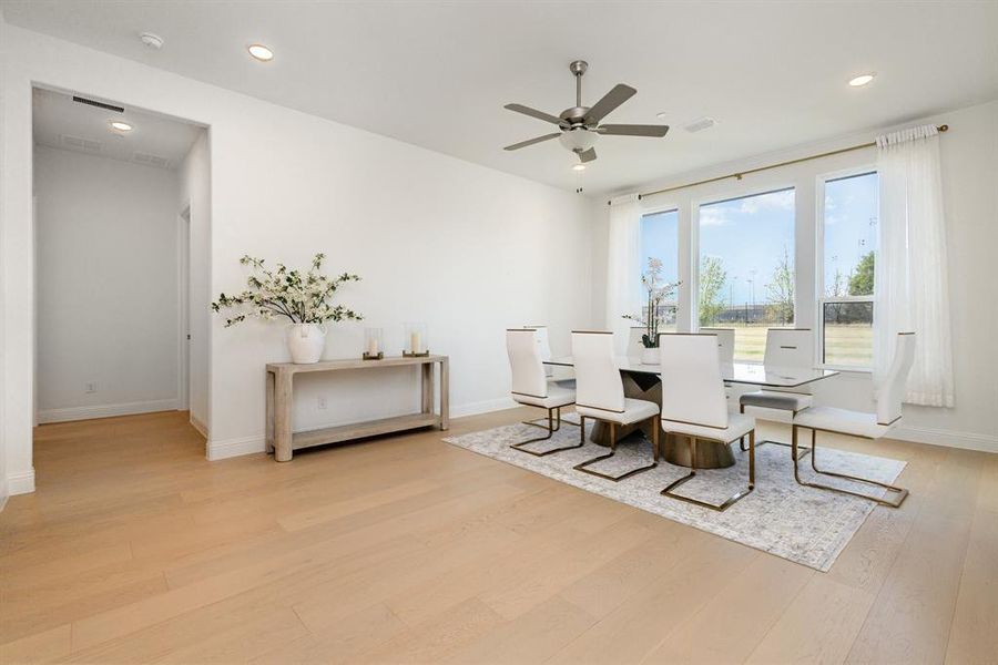 Dining space featuring recessed lighting, light wood-style floors, and a ceiling fan