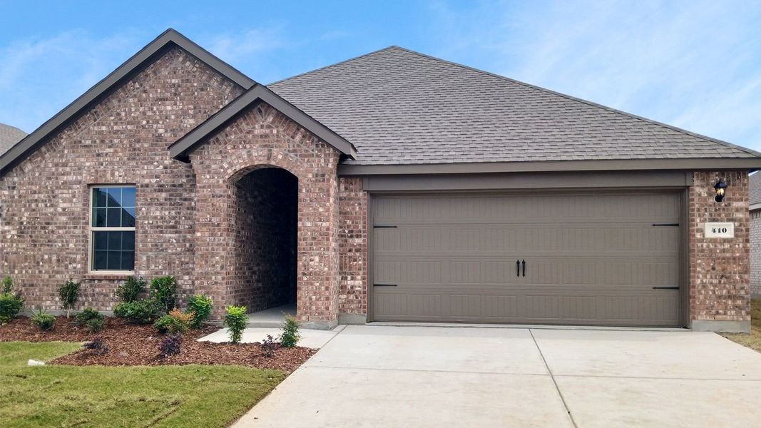 Front exterior of a new home in Trailstone, Caddo Mills, TX, highlighting curb appeal (Image 1). Front exterior of a new home in Trailstone, Caddo Mills, TX, highlighting curb appeal (Image 1).