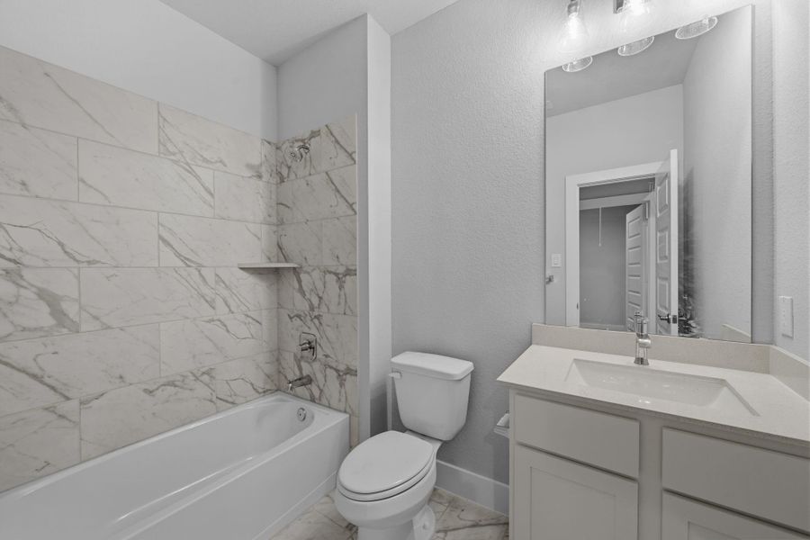 Furnished interior view inside a new home in Barton Creek Ranch, Conroe (Image 9).