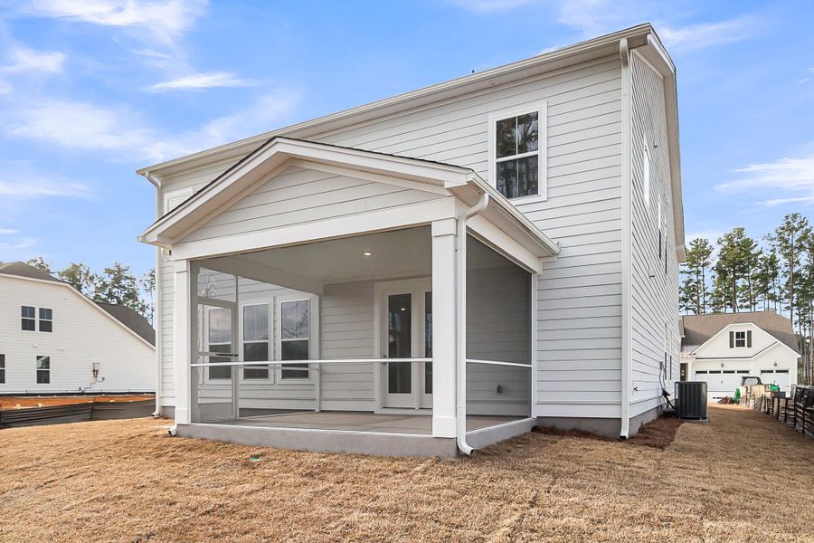 Exterior details and patio area of a home in Tidewater at Lakes of Cane Bay, Summerville (Image 27).