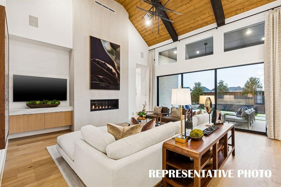 Featuring a full wall slider, it's easy to take the party outdoors in this dream home!  REPRESENTATIVE PHOTO