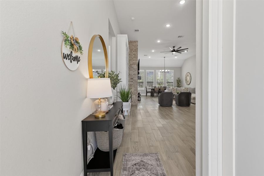 Entry hallway leading into open-concept living space. Entry hallway leading into open-concept living space.