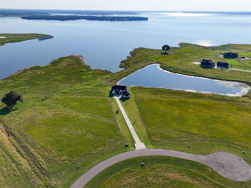Aerial view of property's location featuring a nearby body of water Aerial view of property's location featuring a nearby body of water