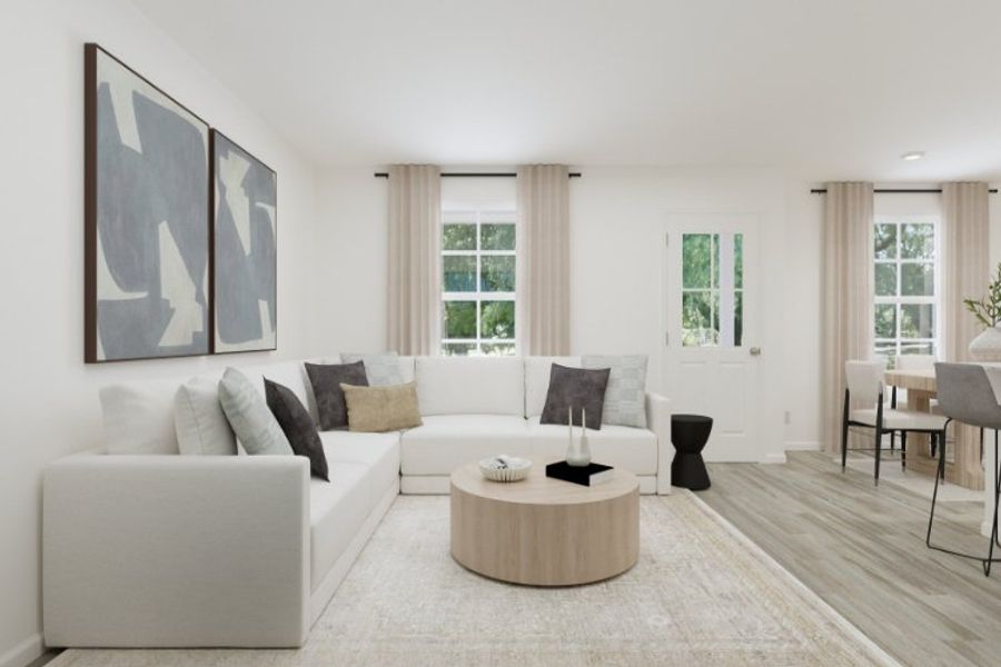 A living room with a white couch. A living room with a white couch.