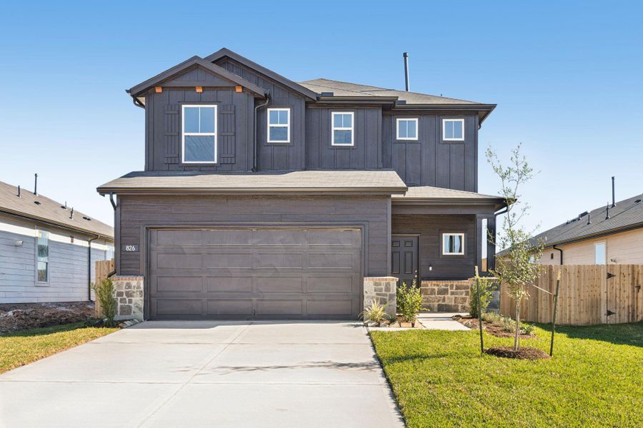 Front exterior of a new home in Montgomery Bend, Montgomery, TX, highlighting curb appeal (Image 2). Front exterior of a new home in Montgomery Bend, Montgomery, TX, highlighting curb appeal (Image 2).