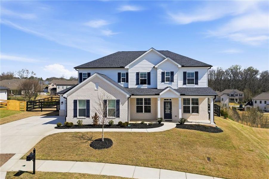 Front exterior of a new home in Carmichael Farms, Canton, GA, highlighting curb appeal (Image 25).