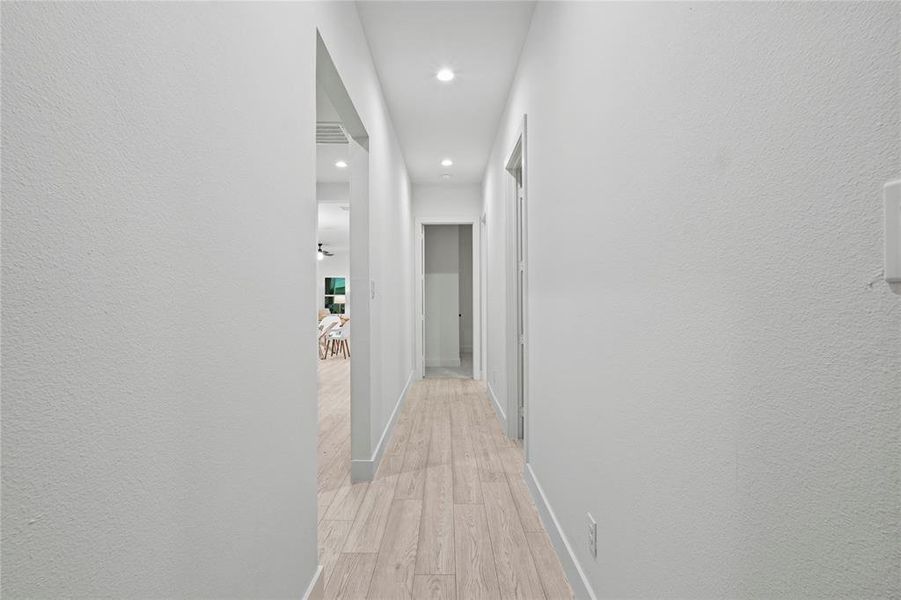 Hallway with light wood-type flooring