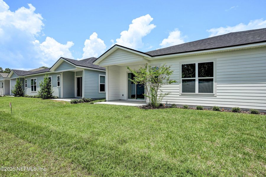 Front exterior of a new home in Everlake at Mandarin, Jacksonville, FL, highlighting curb appeal (Image 25).