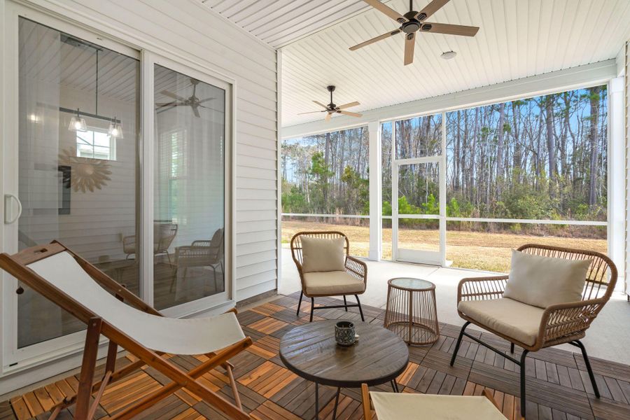 Exterior details and patio area of a home in Summerwind Crossing at Lakes of Cane Bay, Summerville (Image 24).