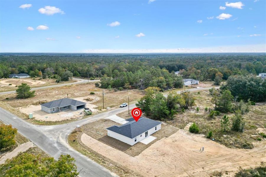 Front exterior of a new home in , Ocklawaha, FL, highlighting curb appeal (Image 18).
