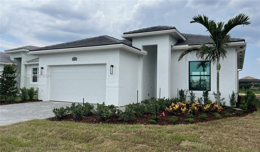Front exterior of a new home in , Port St. Lucie, FL, highlighting curb appeal (Image 21).