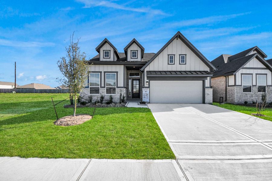 Front exterior of a new home in Meridiana, Manvel, TX, highlighting curb appeal (Image 23).