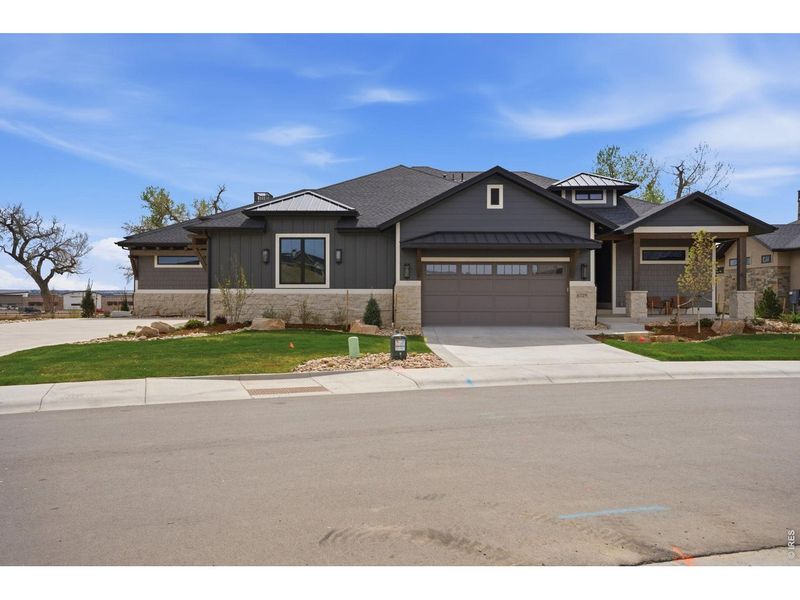 Front exterior of a new home in , Timnath, CO, highlighting curb appeal (Image 22).