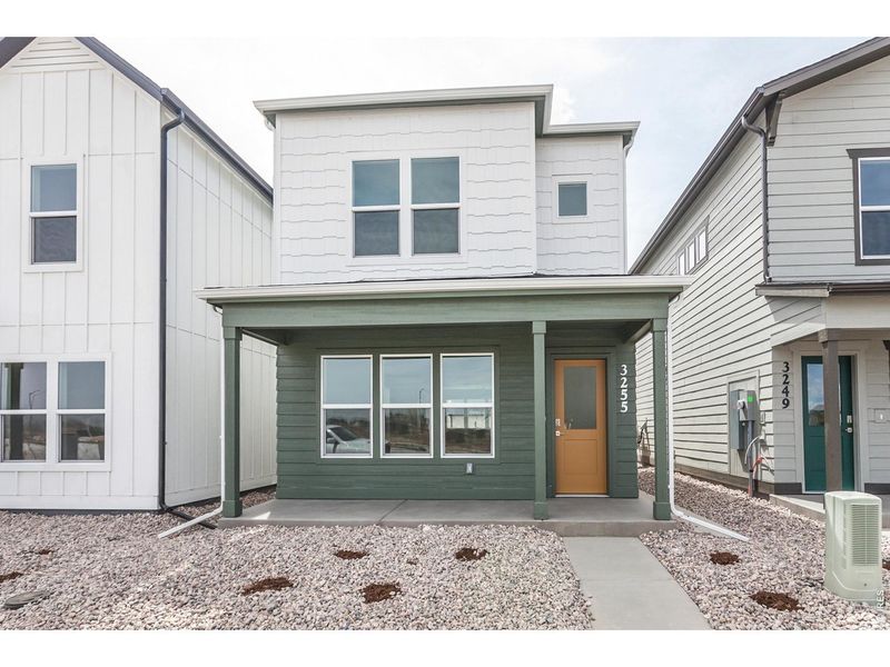 Exterior details and patio area of a home in Bloom Trailblazer Collection - Single Family Homes, Fort Collins (Image 1). Exterior details and patio area of a home in Bloom Trailblazer Collection - Single Family Homes, Fort Collins (Image 1).
